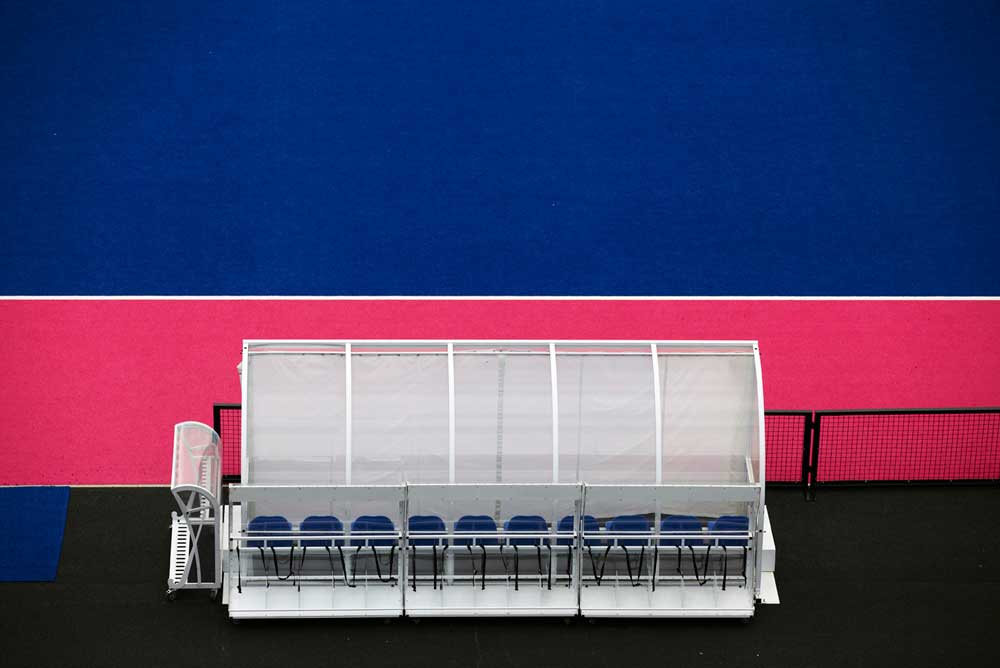 players bench from above with pink and blue pitch of olympics by airey spaces