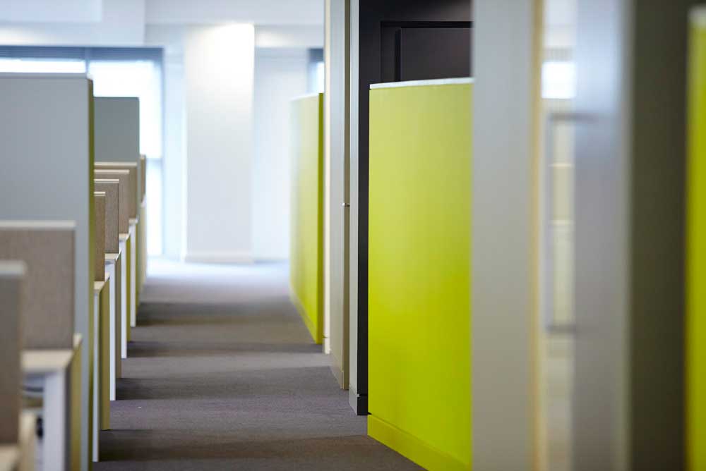 modern office area with luminous green wall by airey spaces