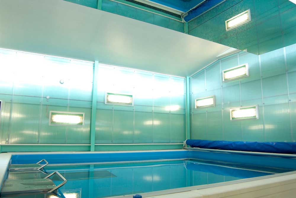 current swimming pool and turquoise wall in swim centre by airey spaces