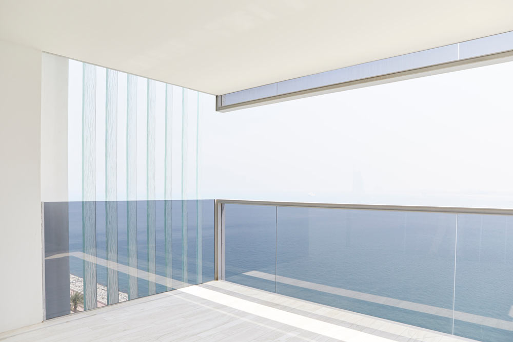 glass panels on balcony with sea view in modern apartments Muraba Residences on Palm Jumeirah by Airey Spaces